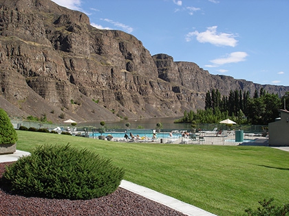 The large pool and cloverleaf spa are located down close to the river.